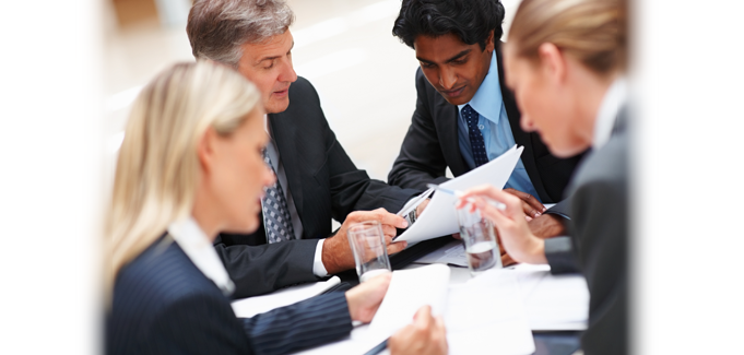 Two women and two men having a working lunch