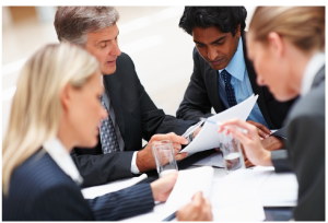 Three employees and their supervisor in a meeting